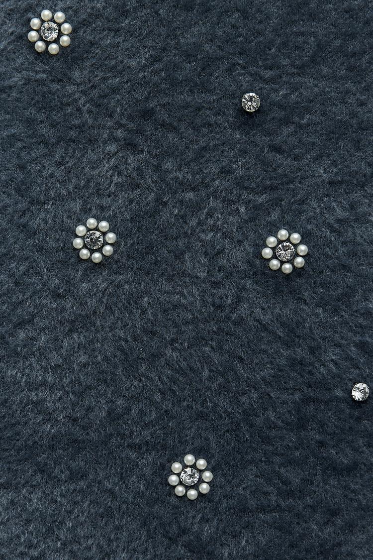 Lola | Gebreide Minikleed met Parels en Gerimpelde Zoom