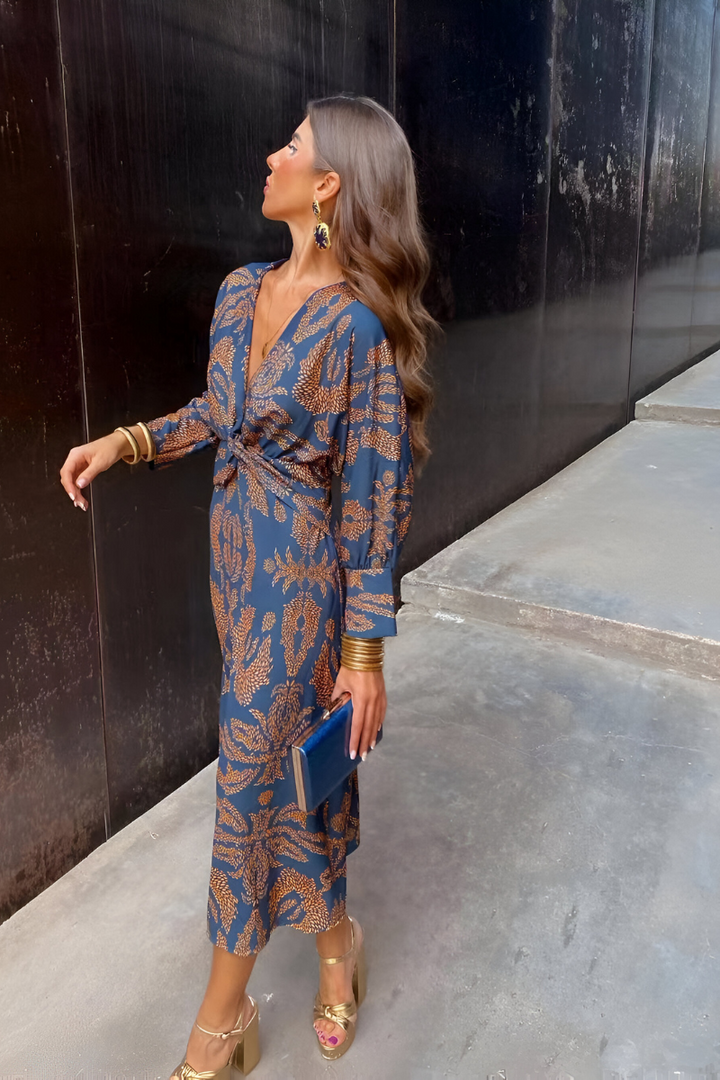Elegante midi-jurk met twist-detail en bloemenpatroon – Tijdloos en stijlvol