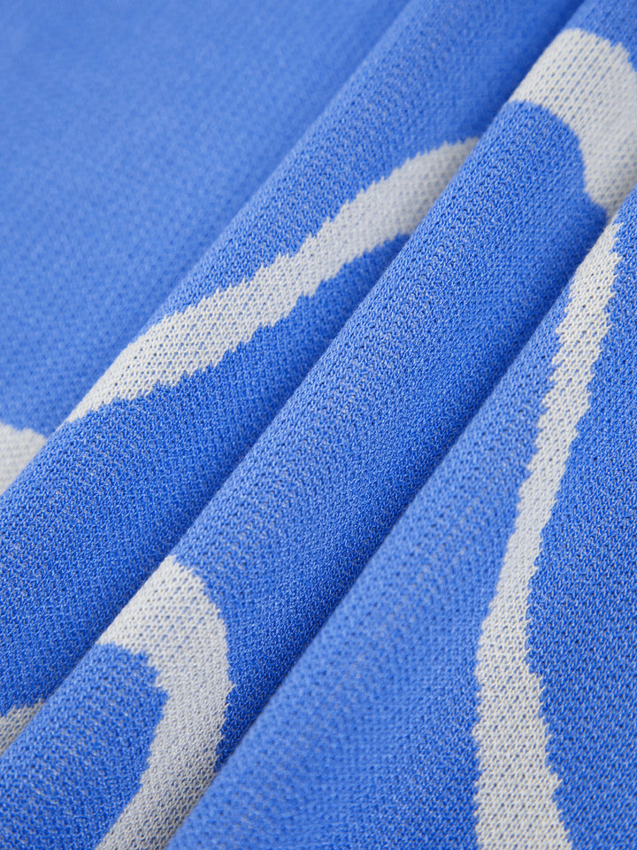 Maisie | Figuuraccentuerende midijurk met abstract patroon en delicate spaghettibandjes