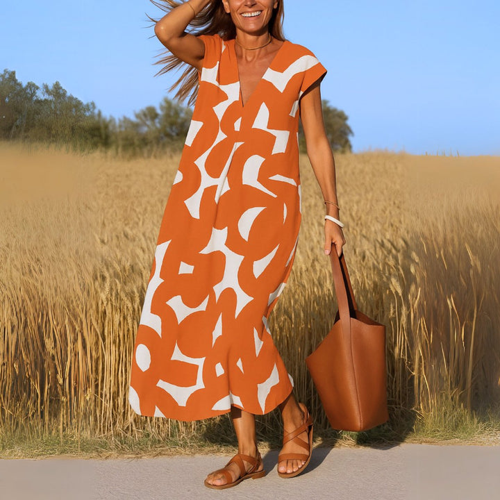 Dames Vloeiende Maxi-jurk met V-hals en Grafische Print - Oranje